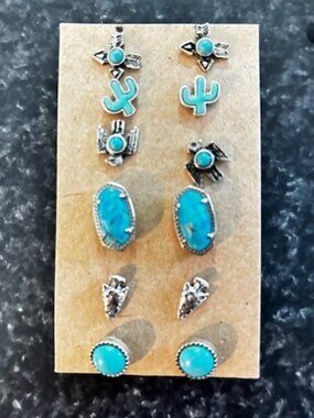 Six pairs of turquoise earrings.  Large rectangle set are by Kendra Scott.